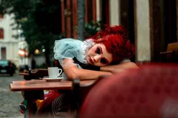 Beautiful young woman dressed as a clown, Beautiful girl dressed as a clown, Girl in carnival...