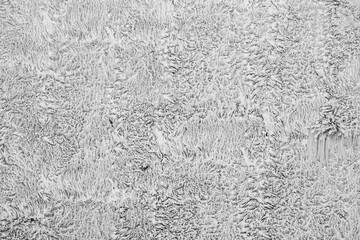 White dirty dusty plain floor surface in a renovated building covered with dust from grinding and painting the walls. White dirty monochrome background.