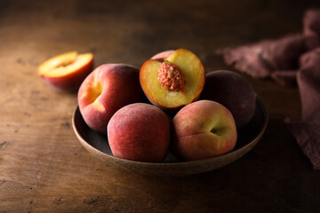 Fresh ripe peaches in a bowl