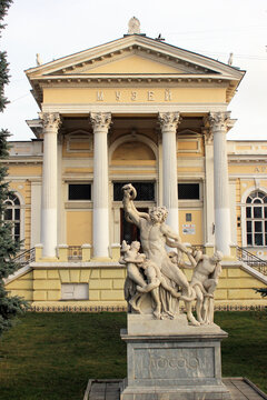 Odessa, Ukraine - December 16, 2017: Copy of the famous sculptural group Laocoon and His Sons in front of the Odessa Archaeological Museum, founded in 1825.