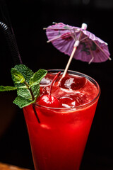 fruit cocktail with ice and umbrella