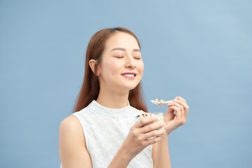 Smiling Girl Having Yoghurt Oatmeal Dessert For Breakfast.