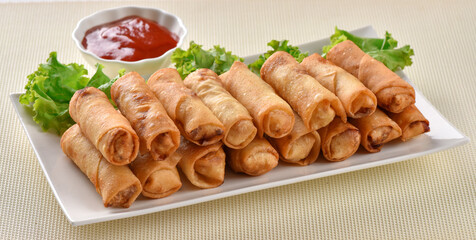 Spring Roll, stuffed with spring onion and other vegetables and Chicken Roll stuffed with boneless chicken and spices