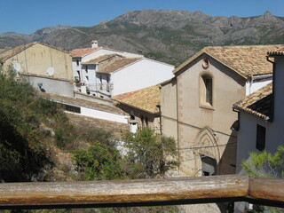 Fototapeta na wymiar view of the old houses and roofs from above in mountains. Guadlest. Spain