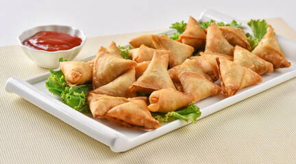 Chicken and Vegetable Samosa, Pakistan and India's most eating snack. Triangle Shape Crunchy Wraps and stuffed with vegetables and chicken.