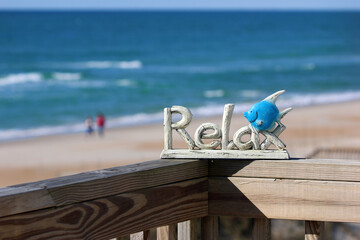 Relax knick knack reminds us to unwind and refresh at the beach on the ocean.
