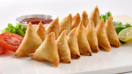 Chicken and Vegetable Samosa, Pakistan and India's most eating snack. Triangle Shape Crunchy Wraps and stuffed with vegetables and chicken.