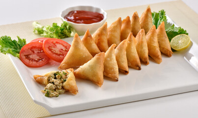 Chicken and Vegetable Samosa, Pakistan and India's most eating snack. Triangle Shape Crunchy Wraps and stuffed with vegetables and chicken.