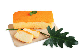 Butter cake sliced and loaf, Decorated topping with Thai dessert-Sweet egg floss, Peppermint and Philodendron Xanadu leaf placed on wooden cutting board, Homemade bakery isolated on white background.
