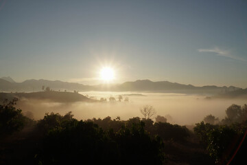 sun rises over the mountains and the sea of ​​mist at Doi Muang Chiang Dao.