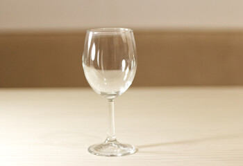 An empty wine glass sits on the table