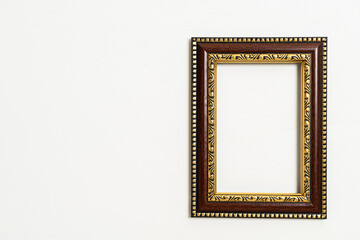 empty picture frame on white wall background