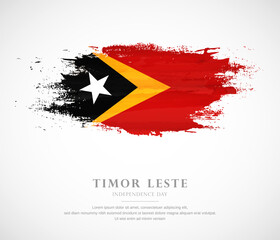 Abstract watercolor brush stroke flag for independence day of Timor Leste