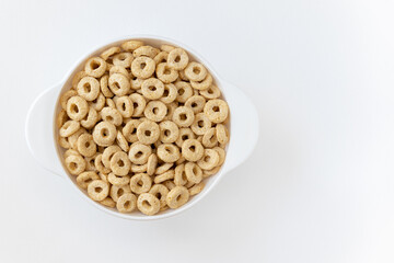 cereal cheerios in bowl on white background