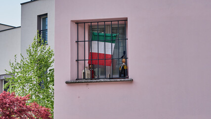 Fototapeta na wymiar MILANO, ITALY - APRIL 19, 2021: Metaphor of Italy during the pandemic from a window of a building in Milan.