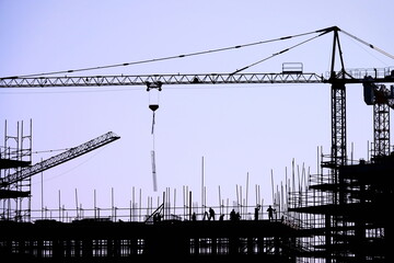 The group of workers working at a construction site.