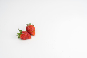 Strawberries on a light background. Summer concept, harvest, there is a place for text