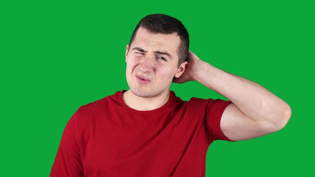 guy scratches his head on a green screen