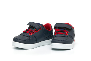 Chidren´s dark blue shoes isolated on the white background.