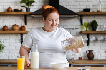 Hungry starving fat caucasian woman cooking healthy dieting breakfast. Plump overweight woman...