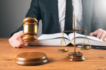 the judge hits with a hammer