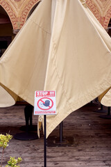 Alert sign for limited access due to Covid pandemic situation, in a public pub of Vigevano city...