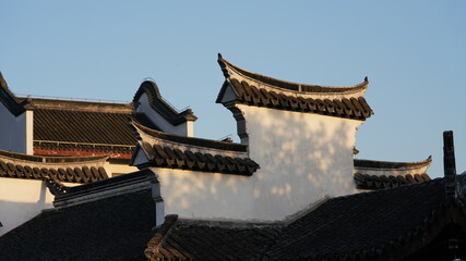 The old classical Chinese architectures with the black tiles roof and white wall designation