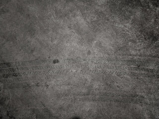 Close up black tire marks on cement floor