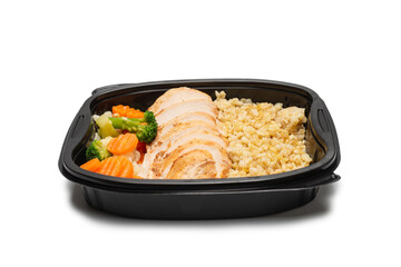 Ready food in a container. Stewed chicken, stewed carrot, cabbage and porridge.