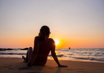 Woman in swiming suit posing on the beach