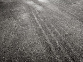 Close up black tire marks on cement floor