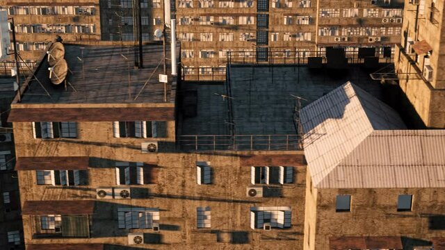 An aerial view over the rooftops of a dilapidated and run-down city slum.