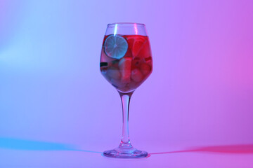 Liquid and fruit in a glass, festive composition, drink, shade, holiday, restaurant, abstract design, color filter