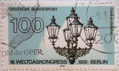 GERMANY - CIRCA 1991 : a postage stamp from Germany, showing an antique gas street lamp with four candelabra. World Gas Congress in Berlin