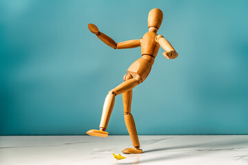 wooden man slipped on a banana peel