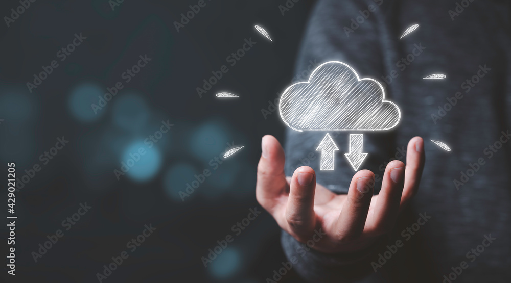 Poster businessman holding white cloud computing icon from hand drawing with blue bokeh background , cloud 