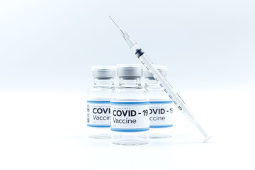 Close up Vaccine and syringe injection, treatment to cure Covid 19 Coronavirus. , Its uses for...