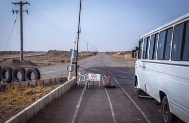 Bus on the checkpoint on the road to Maranjab desert, Esfahan province, Iran