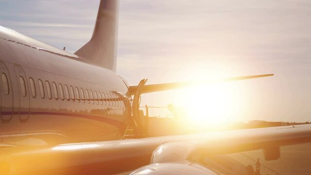 Airplane at the sunset in 4k slow motion 60fps