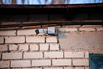 Security Camera, CCTV. Security camera on the brick wall. video surveillance system. Order maintenance.