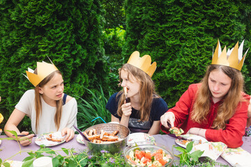 Children having birthday party in green garden