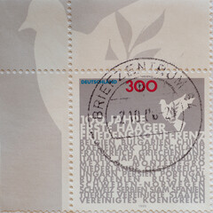 GERMANY - CIRCA 1999 : a postage stamp from Germany, showing a table showing shift 100th anniversary of the First Hague Peace Conference. Names of the member states