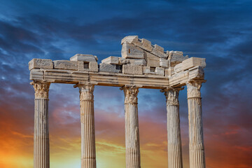 Architectural columns from the times of ancient greece. Ruins against the sunset sky. Side turkey