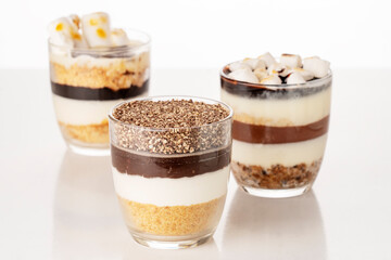 Chocolate dessert with whipped cream on a white background