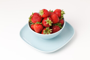Red strawberries in blue cups
