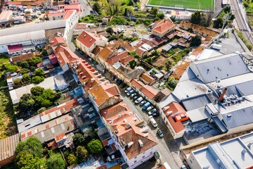 Fototapeta premium Aerial view of a small residential district in Lisbon outskirt along a railway, Marvila neighbourhood, Lisbon, Portugal.