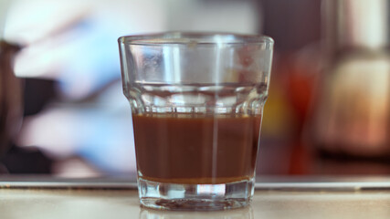 Close up of little glass of espresso cafe.