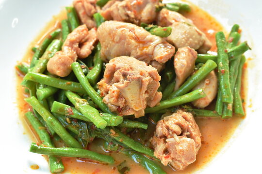 stir fried slice yarg long bean with chicken curry sauce on plate