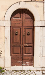 Old wooden italian door in a small village in Abruzzo
