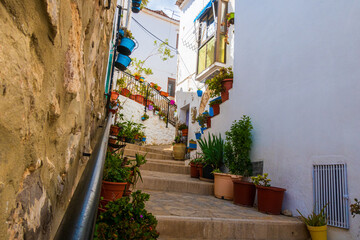 Typical streets of Sot de Chera adorned with beautiful colored flowerpots.